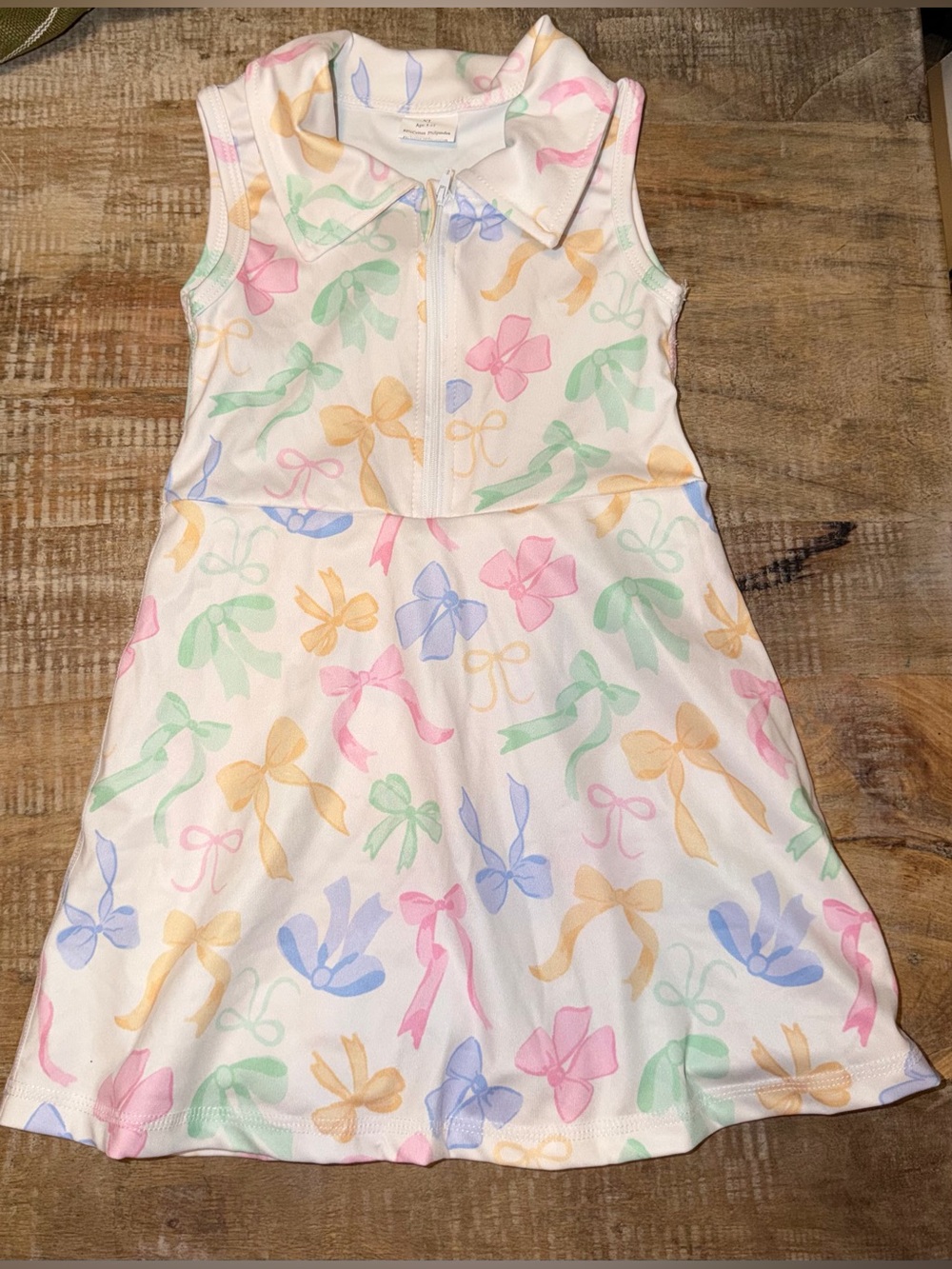 Girls' Sleeveless White Bow Print Dress size 5/6. NWOT